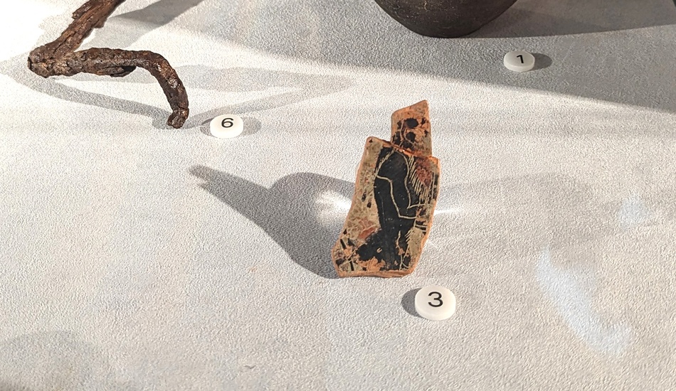 Fragment of a ceramic vase with a painted satyr